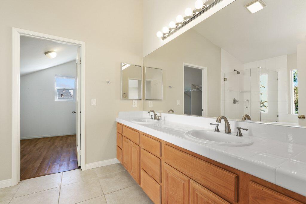 4695 Ellington Street Ventura, CA 93003 - Photo 29 of 43 a bathroom with a sink and a mirror