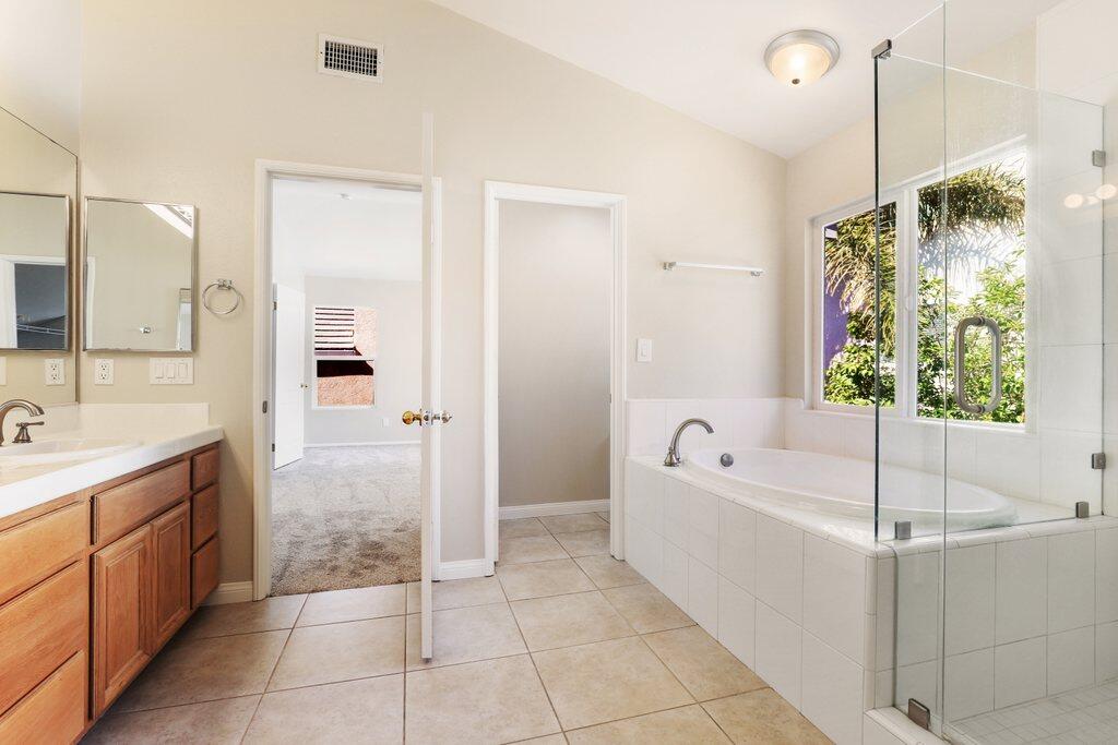 4695 Ellington Street Ventura, CA 93003 - Photo 30 of 43 a bathroom with a bathtub and a sink