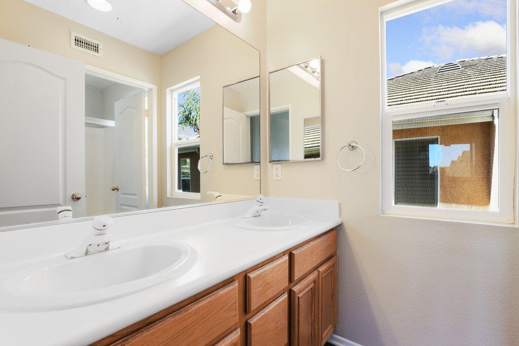 4695 Ellington Street Ventura, CA 93003 - Photo 33 of 43 a bathroom with a sink and a mirror
