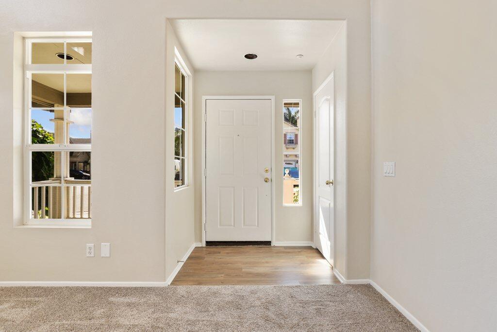 4695 Ellington Street Ventura, CA 93003 - Photo 5 of 43 a view of a hallway with wooden floor and closet