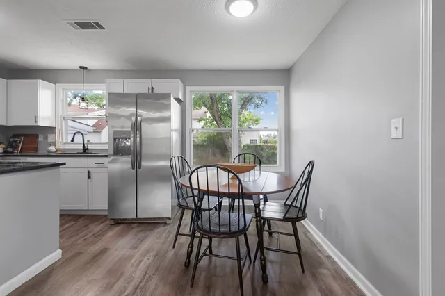 a view of a dining room with furniture window and outside view