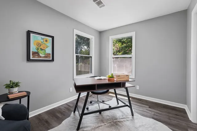 a view of a workspace with furniture