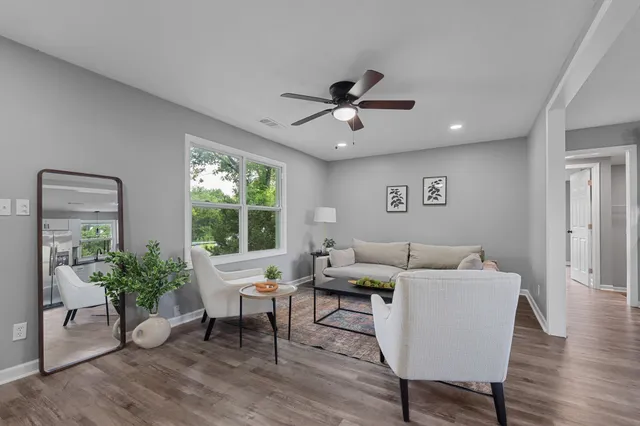 a living room with furniture and a window