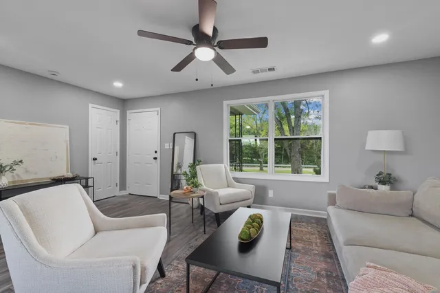 a living room with furniture and a window