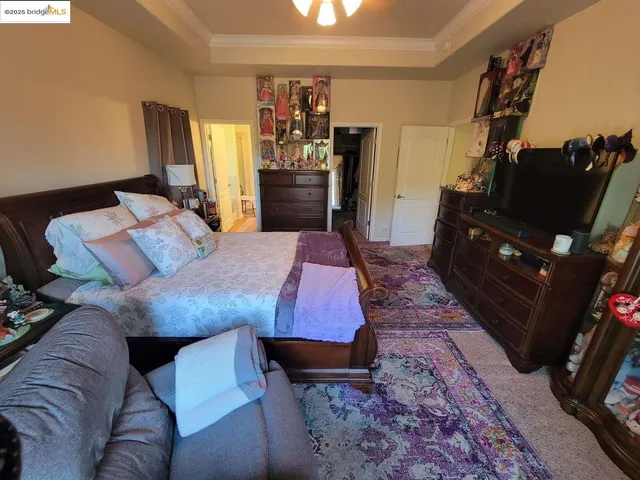 a bedroom with bed and a closet