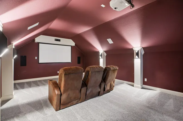 a dining room with furniture and a chandelier