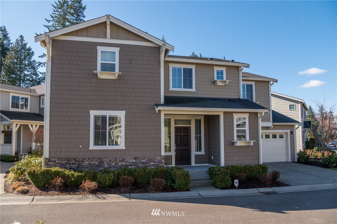 3818 219th Place Southeast Bothell, WA 98021 - Photo 1 of 1 a front view of a house with garden
