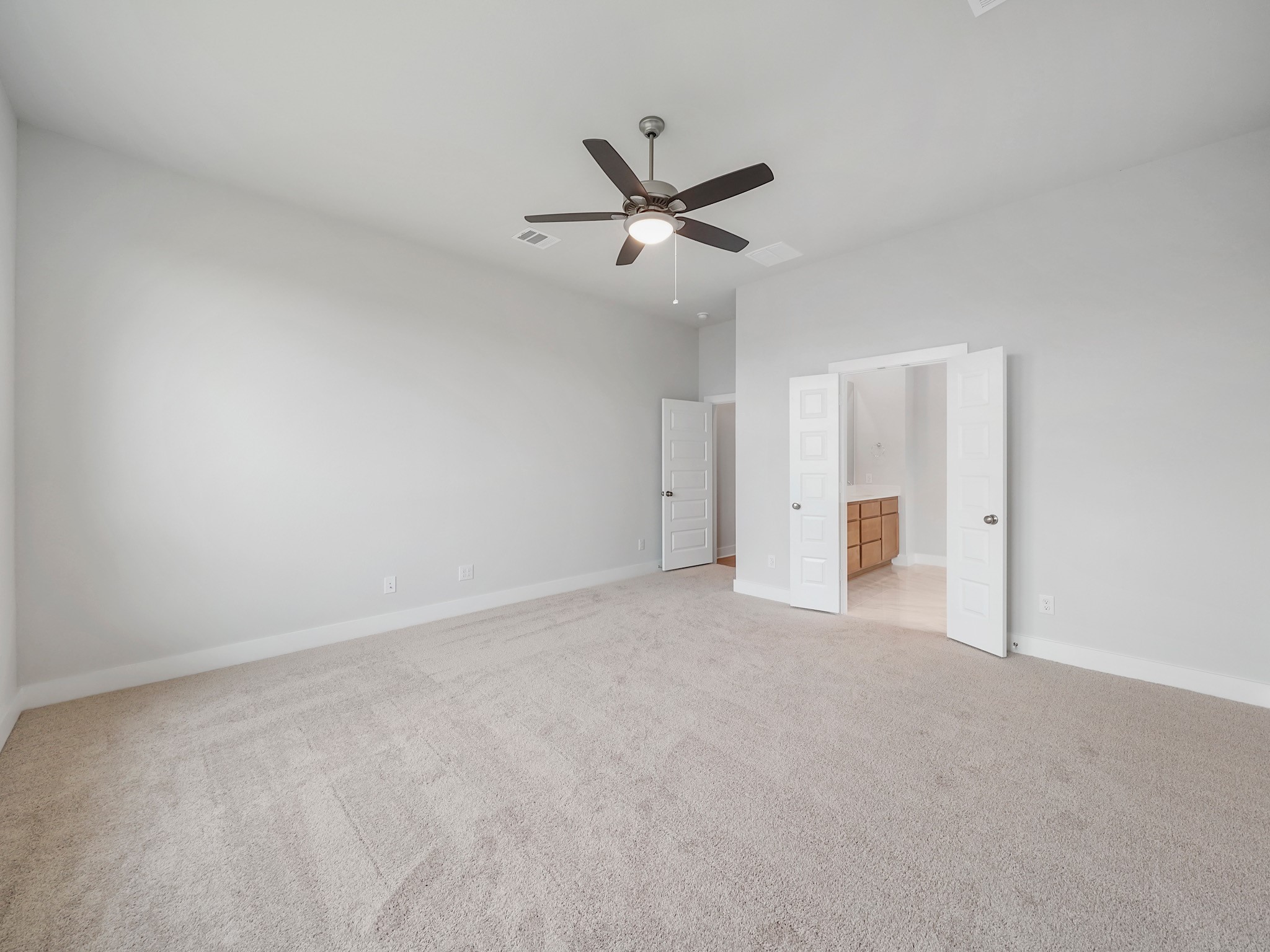 6010 Rolling Strm Court Fulshear, TX 77441 - Photo 9 of 23 Dual doors lead you into the exquisite ensuite bathroom.
