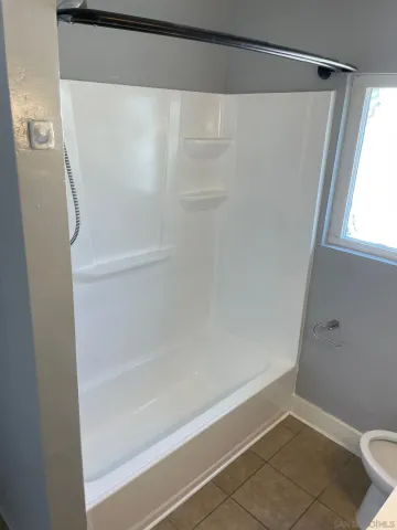 a view of a car parked on the side of a road