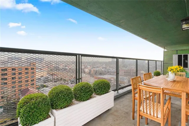 a view of a balcony with a staircase