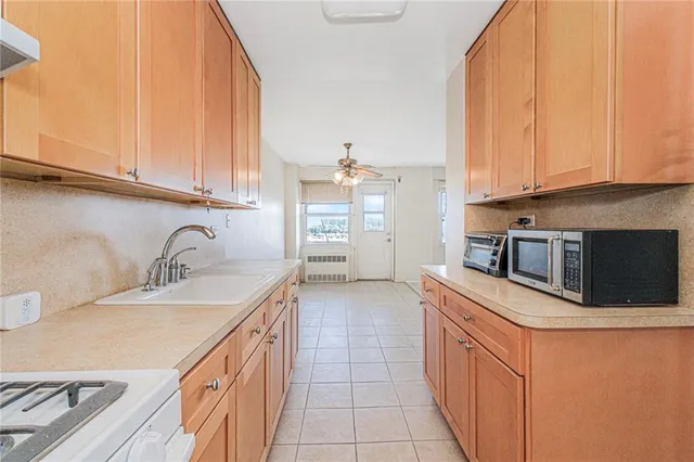 a kitchen with a stove and a microwave