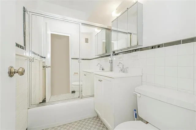 a view of an empty room with a sliding door