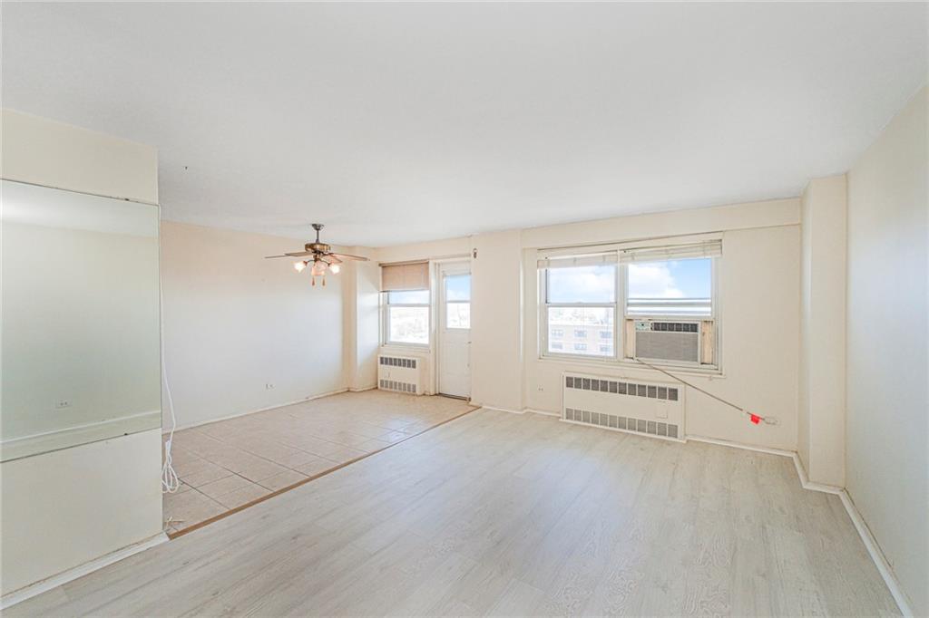 2630 Cropsey Avenue, Unit 9B Brooklyn, NY 11214 - Photo 4 of 29 an empty room with windows and pillars in it