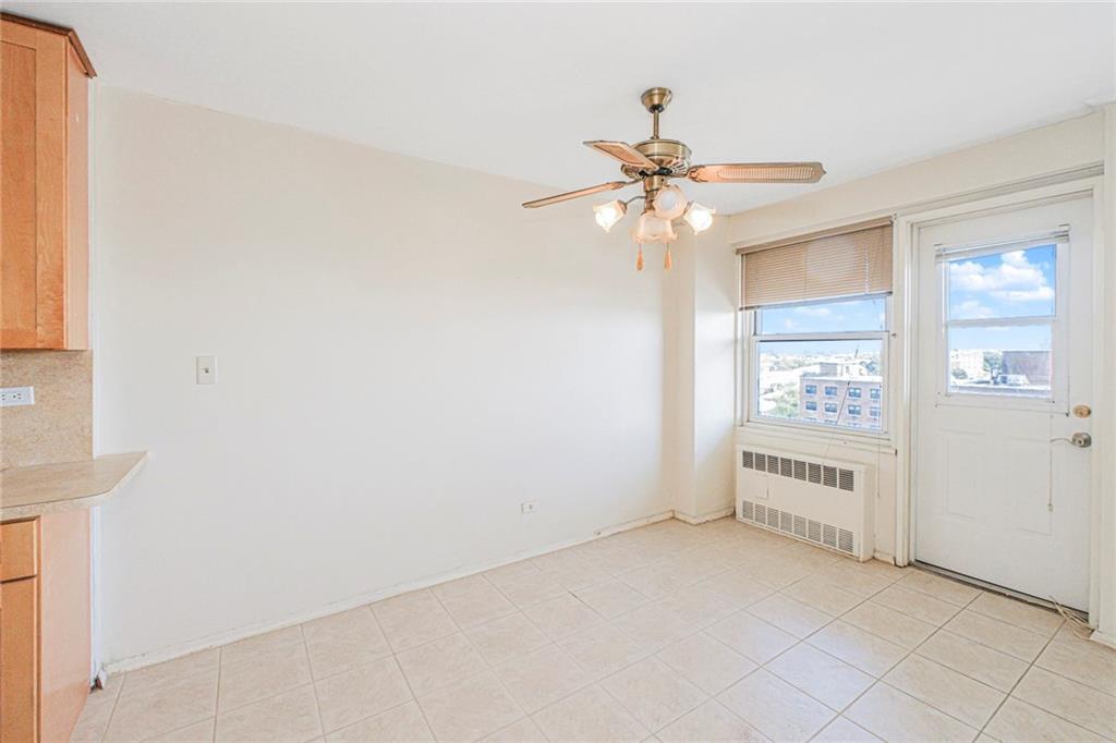 2630 Cropsey Avenue, Unit 9B Brooklyn, NY 11214 - Photo 8 of 29 an empty room with windows and fan