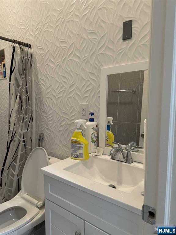 194 Washington Avenue, Unit 1 Rutherford, NJ 07070 - Photo 15 of 29 a bathroom with a sink and a mirror