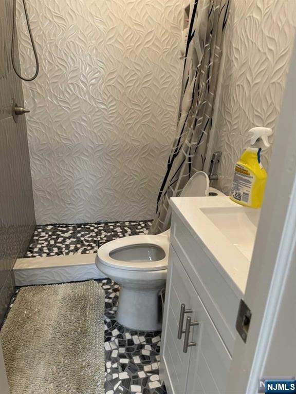 194 Washington Avenue, Unit 1 Rutherford, NJ 07070 - Photo 16 of 29 a bathroom with a sink toilet and shower