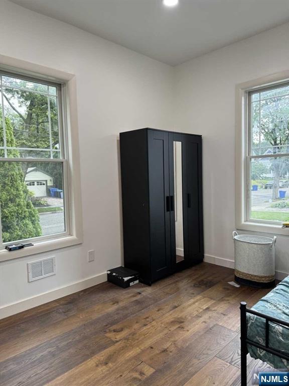 194 Washington Avenue, Unit 1 Rutherford, NJ 07070 - Photo 17 of 29 a view of an empty room with wooden floor and a window