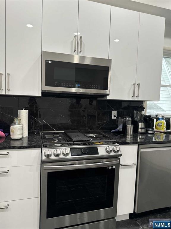 194 Washington Avenue, Unit 1 Rutherford, NJ 07070 - Photo 21 of 29 a kitchen with stainless steel appliances granite countertop a stove and a sink
