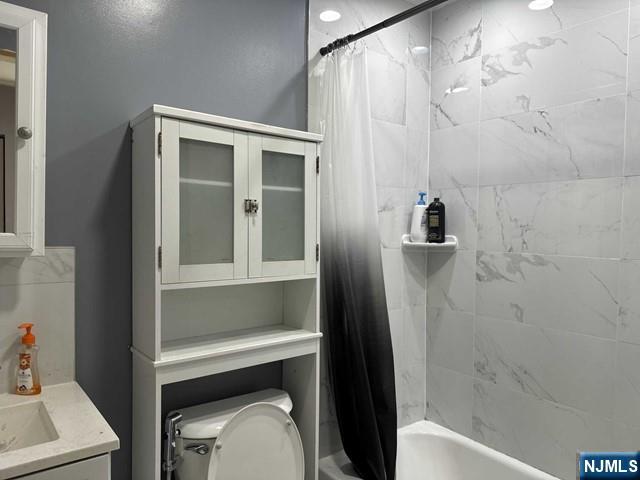 194 Washington Avenue, Unit 1 Rutherford, NJ 07070 - Photo 26 of 29 a bathroom with a toilet and a sink