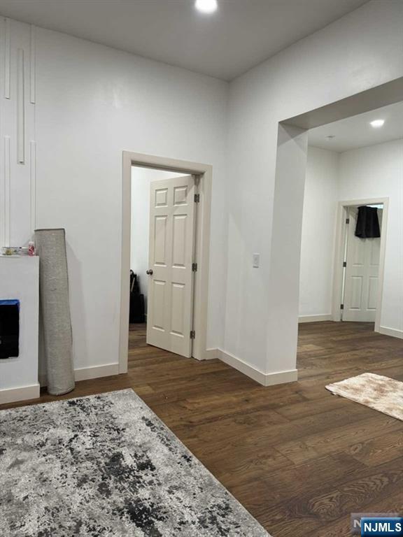194 Washington Avenue, Unit 1 Rutherford, NJ 07070 - Photo 7 of 29 a view of a livingroom with wooden floor and kitchen space