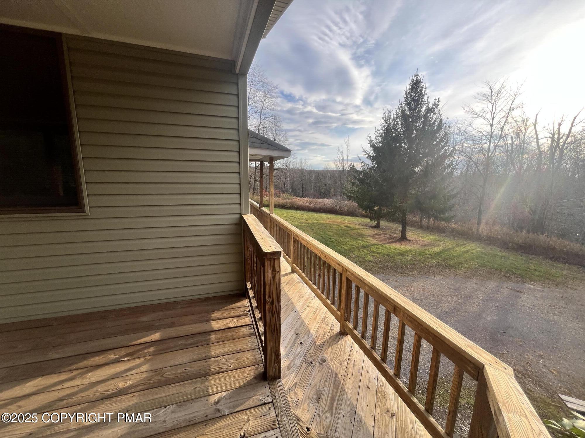 1970 Aberdeen Road Moscow, PA 18444 - Photo 13 of 45 a view of a balcony with wooden floor and fence