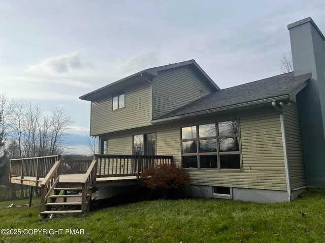 a view of a house with a roof deck