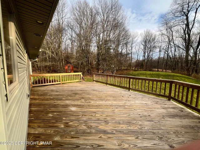 a view of a yard with swimming pool