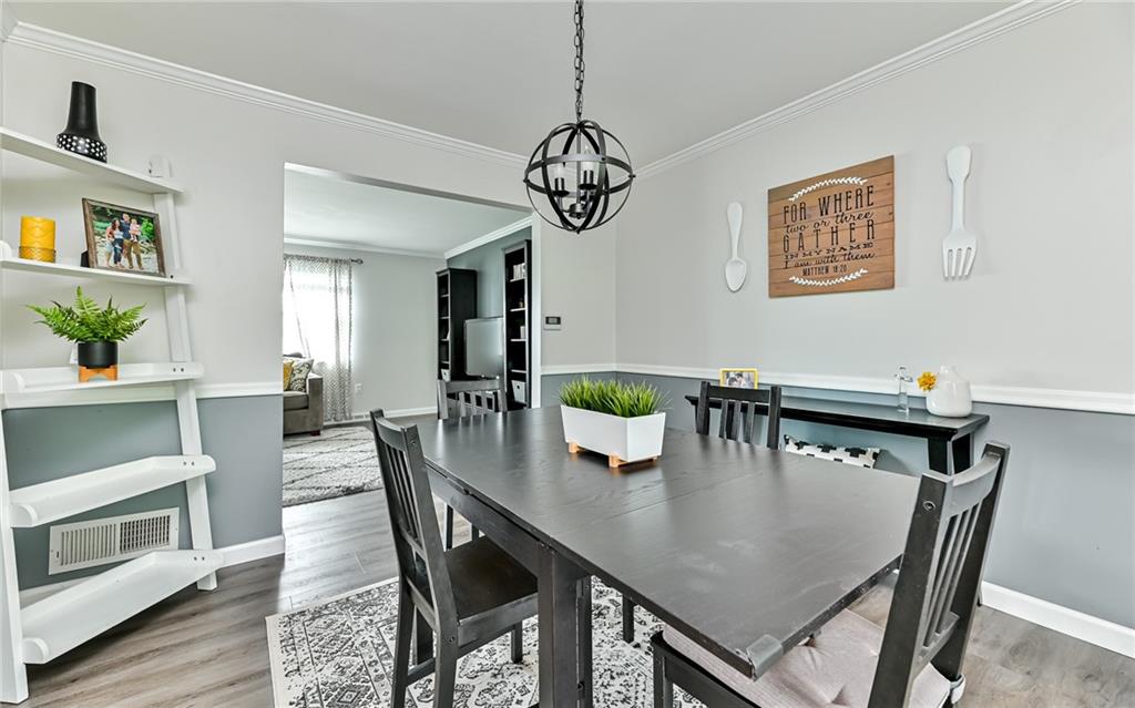 8988 Willoughby Road Pittsburgh, PA 15237 - Photo 12 of 25 a view of a dining room with furniture and wooden floor