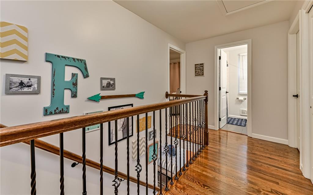 8988 Willoughby Road Pittsburgh, PA 15237 - Photo 16 of 25 a view of a hallway with wooden floor and stairs
