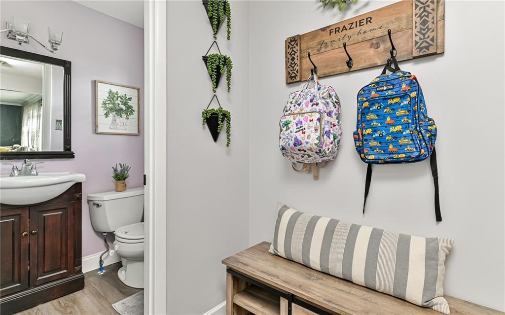 8988 Willoughby Road Pittsburgh, PA 15237 - Photo 3 of 25 a bathroom with a sink toilet and a mirror