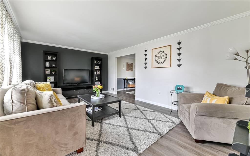 8988 Willoughby Road Pittsburgh, PA 15237 - Photo 5 of 25 a living room with furniture and a flat screen tv