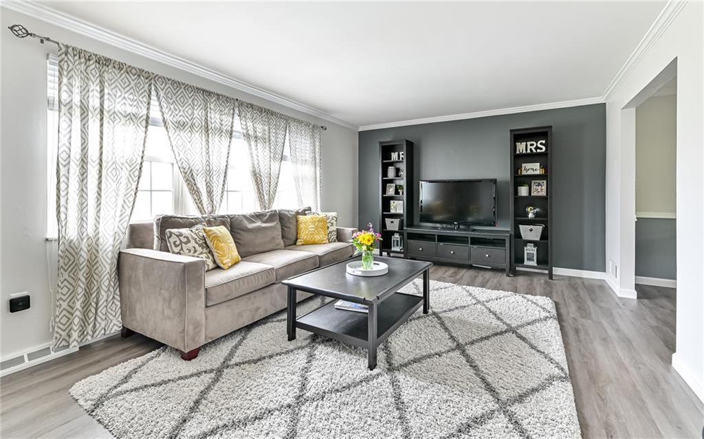 8988 Willoughby Road Pittsburgh, PA 15237 - Photo 6 of 25 a living room with furniture and a flat screen tv