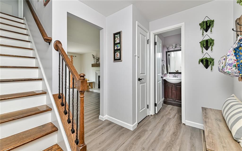 8988 Willoughby Road Pittsburgh, PA 15237 - Photo 7 of 25 a view of a hallway with wooden floor and staircase