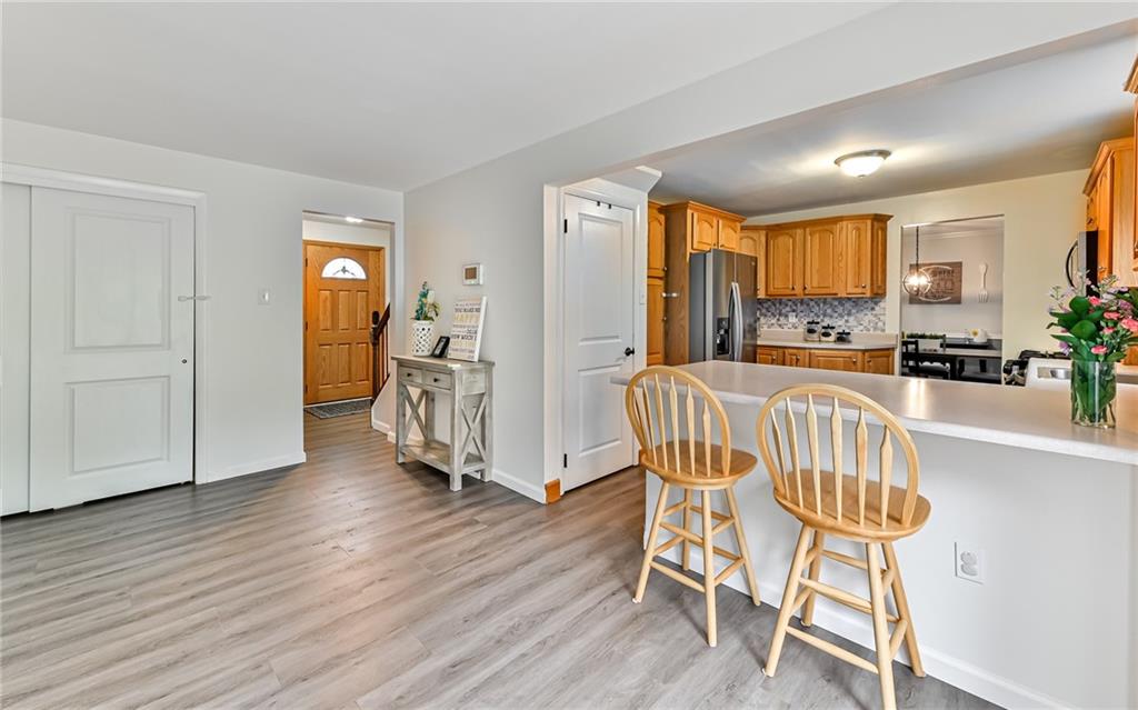 8988 Willoughby Road Pittsburgh, PA 15237 - Photo 10 of 25 a view of a dining room with furniture and wooden floor