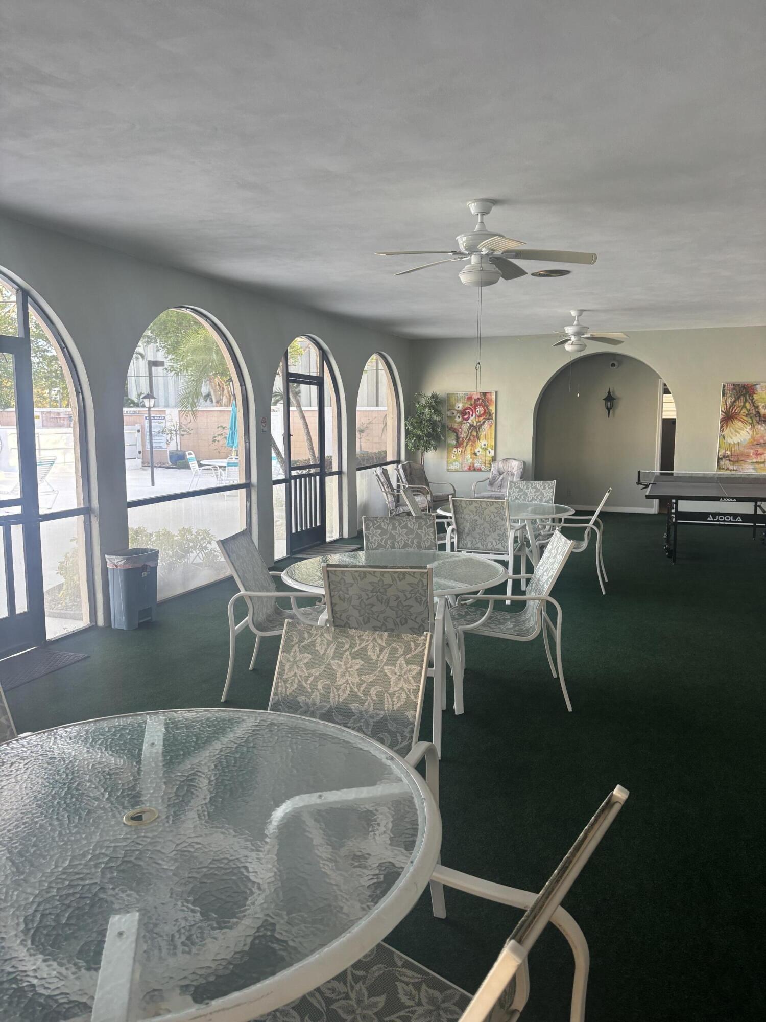 400 Northeast 20th Street, Unit A131 Boca Raton, FL 33431 - Photo 13 of 17 a view of a livingroom with furniture window and wooden floor