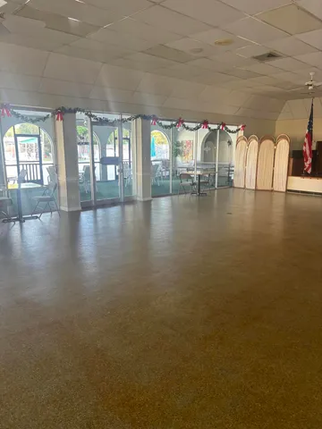 a view of a room with lots of wooden furniture