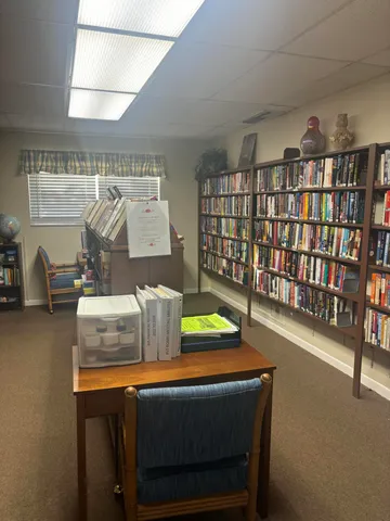 a room with furniture and a book shelf