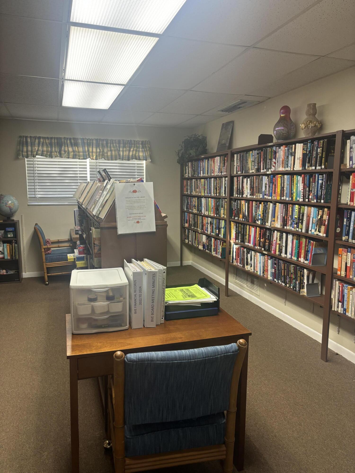 400 Northeast 20th Street, Unit A131 Boca Raton, FL 33431 - Photo 15 of 17 a room with furniture and a book shelf