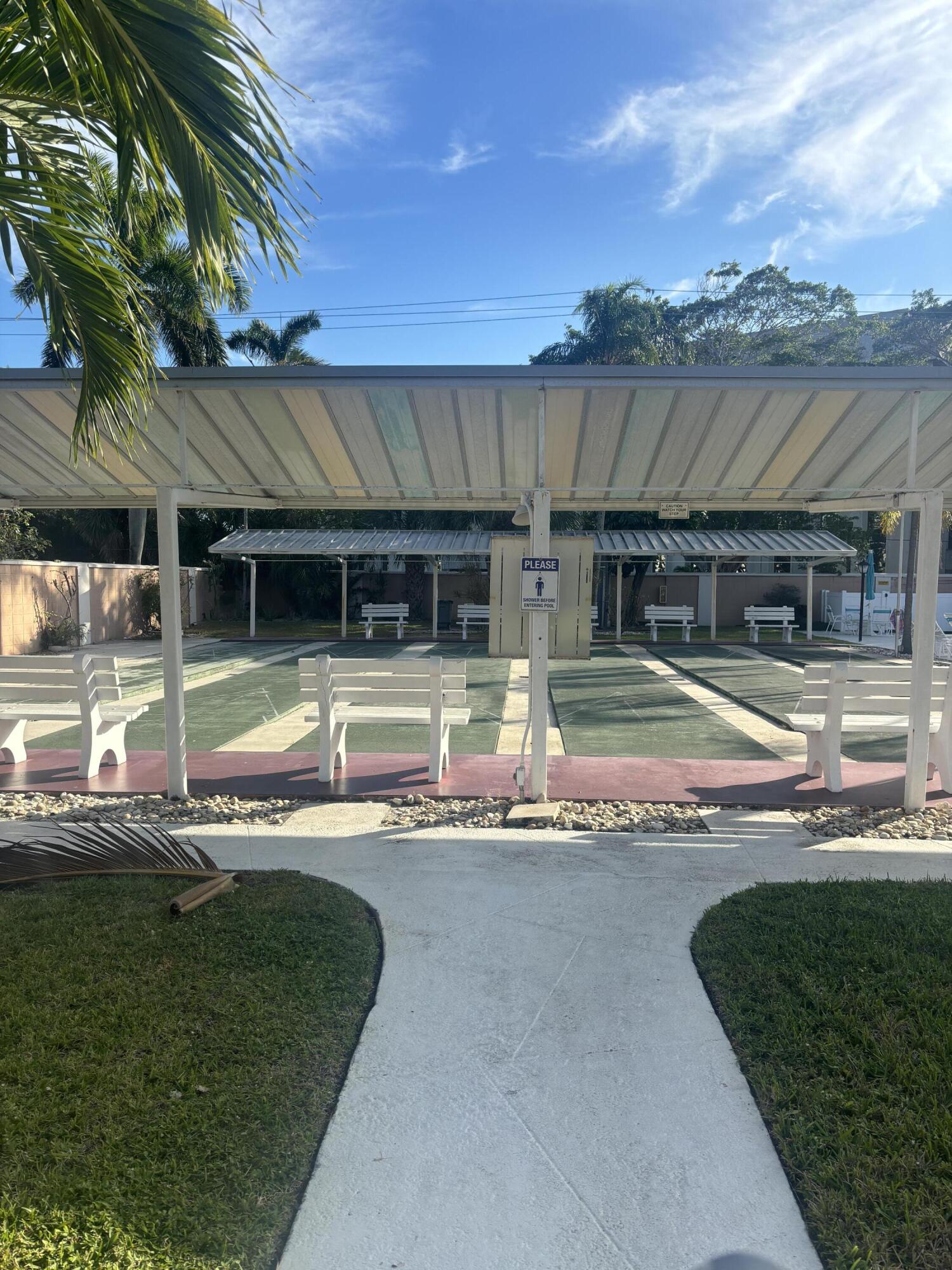 400 Northeast 20th Street, Unit A131 Boca Raton, FL 33431 - Photo 17 of 17 a view of a house with swimming pool and a yard