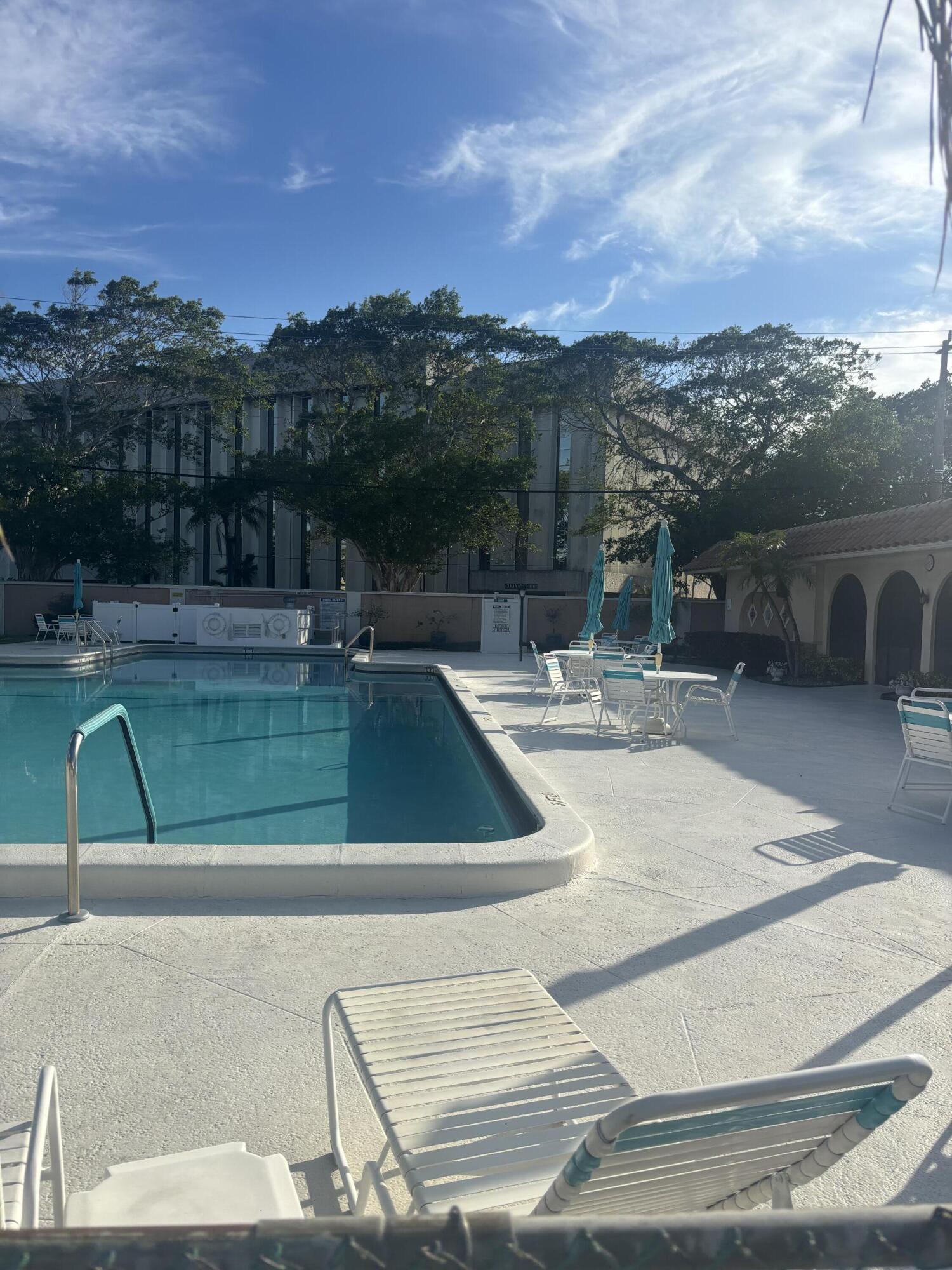 400 Northeast 20th Street, Unit A131 Boca Raton, FL 33431 - Photo 10 of 17 a view of a swimming pool with a lake view and mountain view