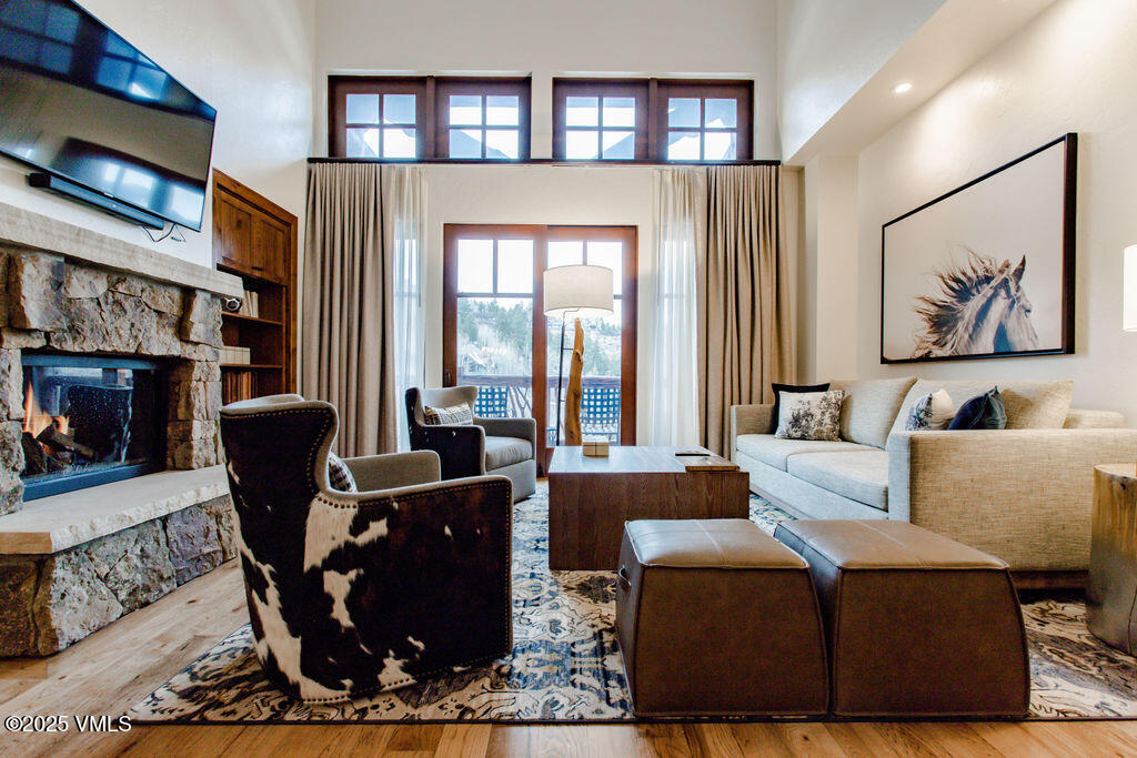 100 Bachelor Ridge Road, Unit 3404/8 Avon, CO 81620 - Photo 1 of 15 a living room with furniture a fireplace and a flat screen tv
