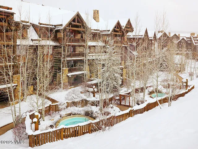 a view of multiple houses with a street