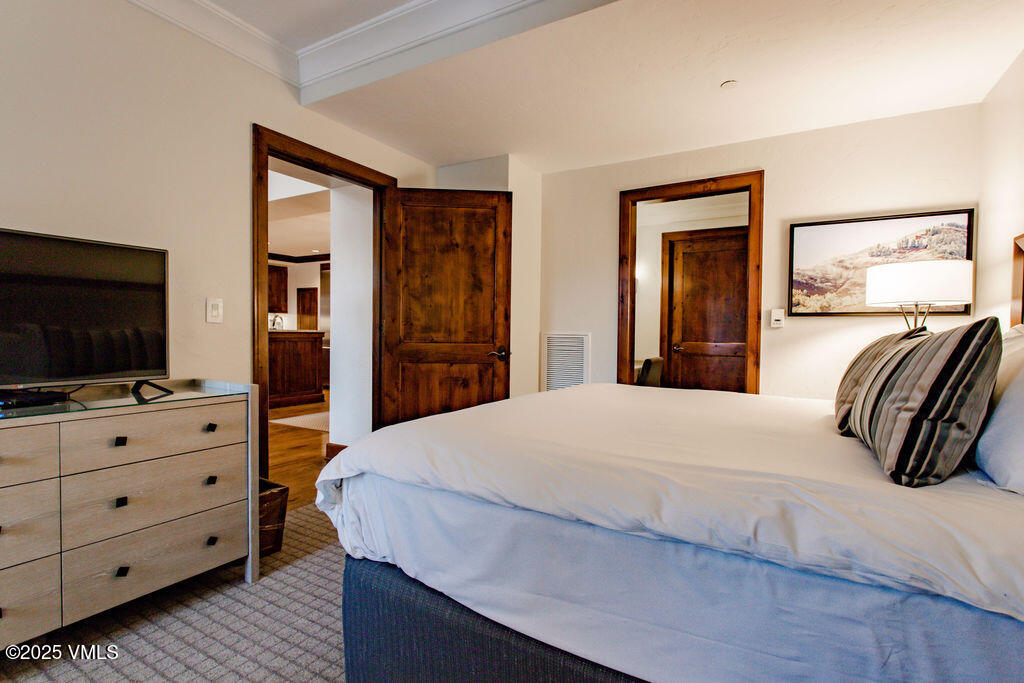 100 Bachelor Ridge Road, Unit 3404/8 Avon, CO 81620 - Photo 6 of 15 a bedroom with a bed and a flat screen tv in it