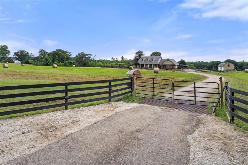 274 County Road Southwest Winnsboro, TX 75494 - Photo 16 of 26 a view of a bench in front of house with a yard