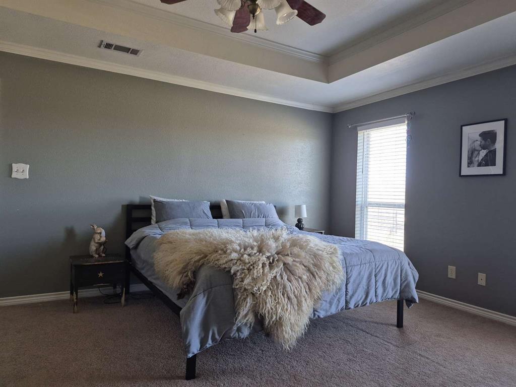 274 County Road Southwest Winnsboro, TX 75494 - Photo 20 of 26 a bedroom with a bed and a window