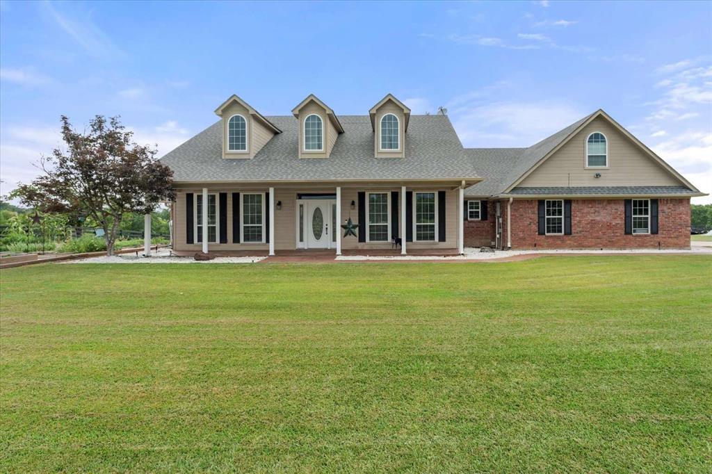 274 County Road Southwest Winnsboro, TX 75494 - Photo 2 of 26 a front view of a house with garden