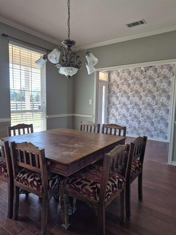 274 County Road Southwest Winnsboro, TX 75494 - Photo 24 of 26 a view of a dining room with furniture window and wooden floor