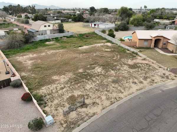 a view of a wooden deck with lake view