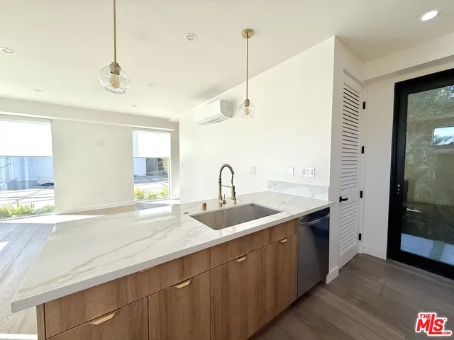 a kitchen with a sink and window