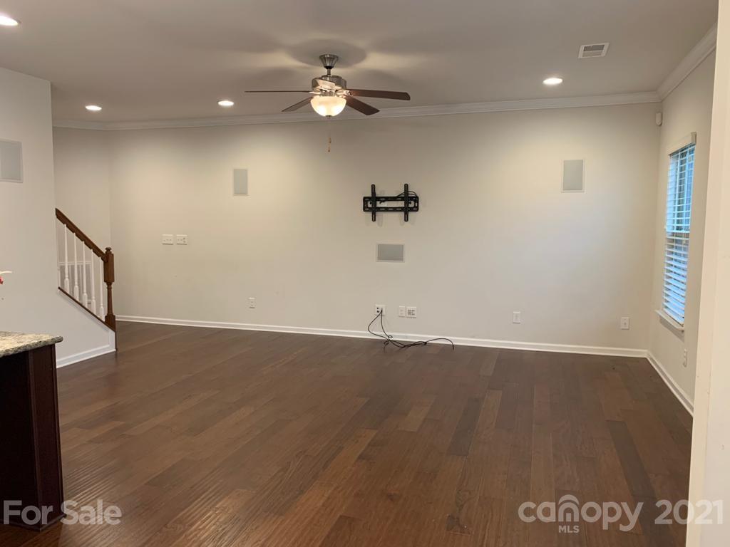 733 Dynamo Street Northwest Concord, NC 28027 - Photo 2 of 24 a view of a livingroom with wooden floor